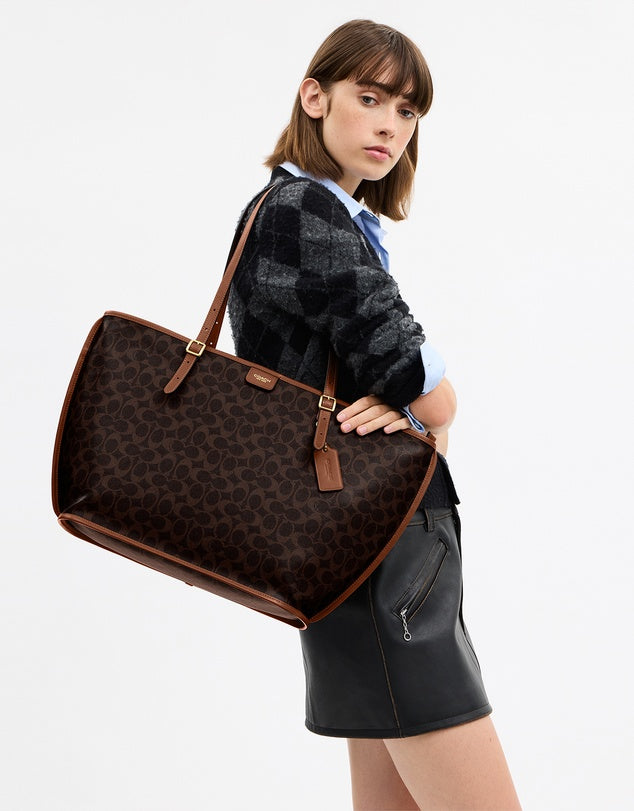 Coach
Signature Coated Canvas Taxi Tote Bag